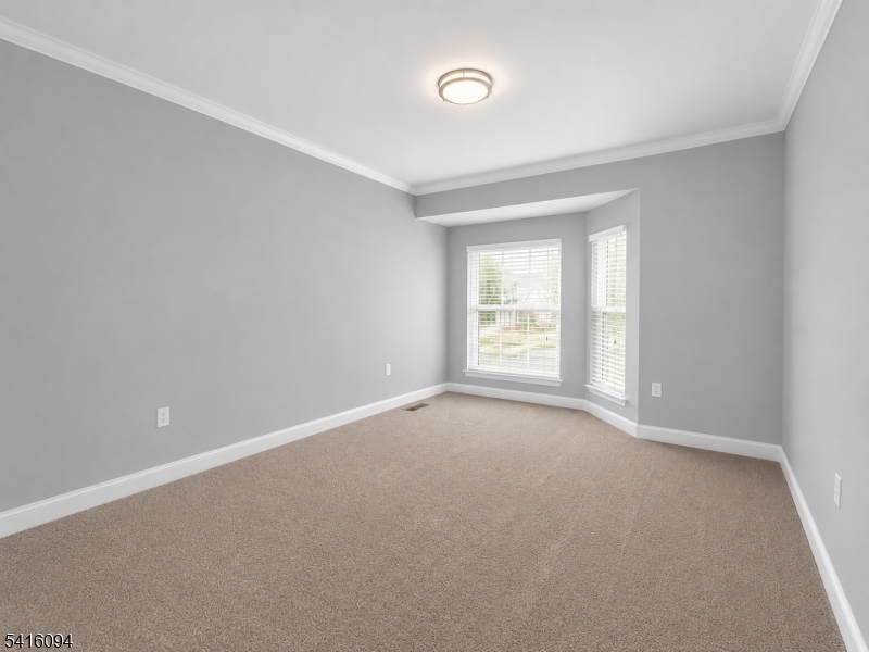 91 Delaware Lane, Unit 91 Somerville, NJ 08876 - Photo 21 of 32 a view of an empty room with a window