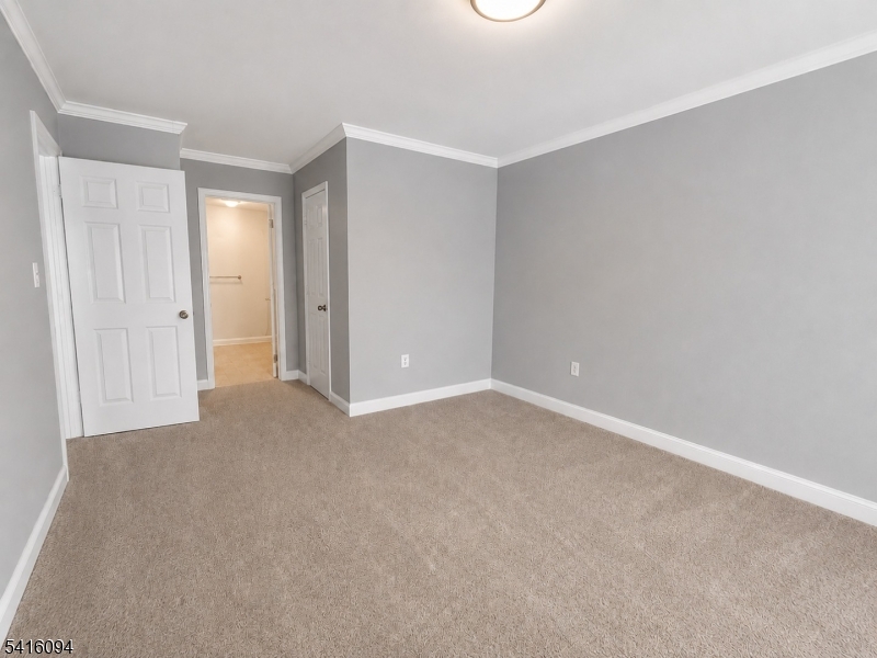 91 Delaware Lane, Unit 91 Somerville, NJ 08876 - Photo 22 of 32 a view of an empty room and closet area