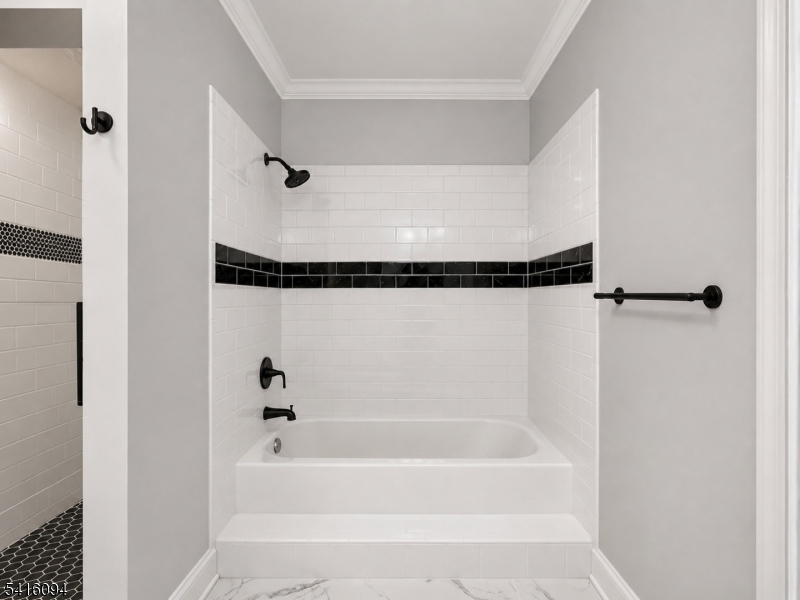91 Delaware Lane, Unit 91 Somerville, NJ 08876 - Photo 26 of 32 a bathroom with a shower and a bath tub
