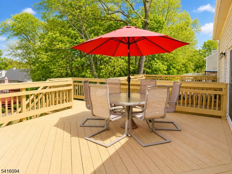 91 Delaware Lane, Unit 91 Somerville, NJ 08876 - Photo 31 of 32 a view of a deck with furniture and a yard