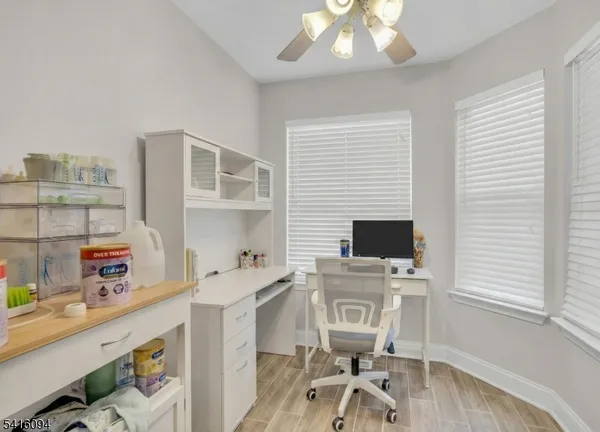 a bedroom with a bed and a night stand