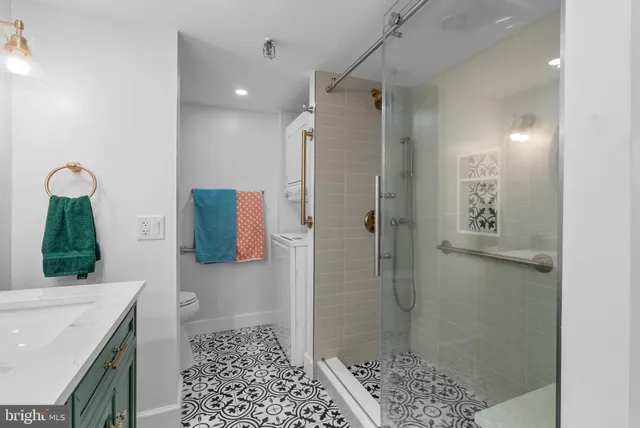 a bathroom with a shower and a sink