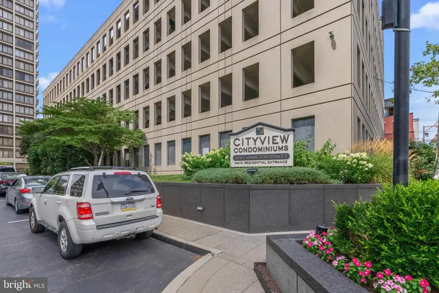 a front view of a house with parking