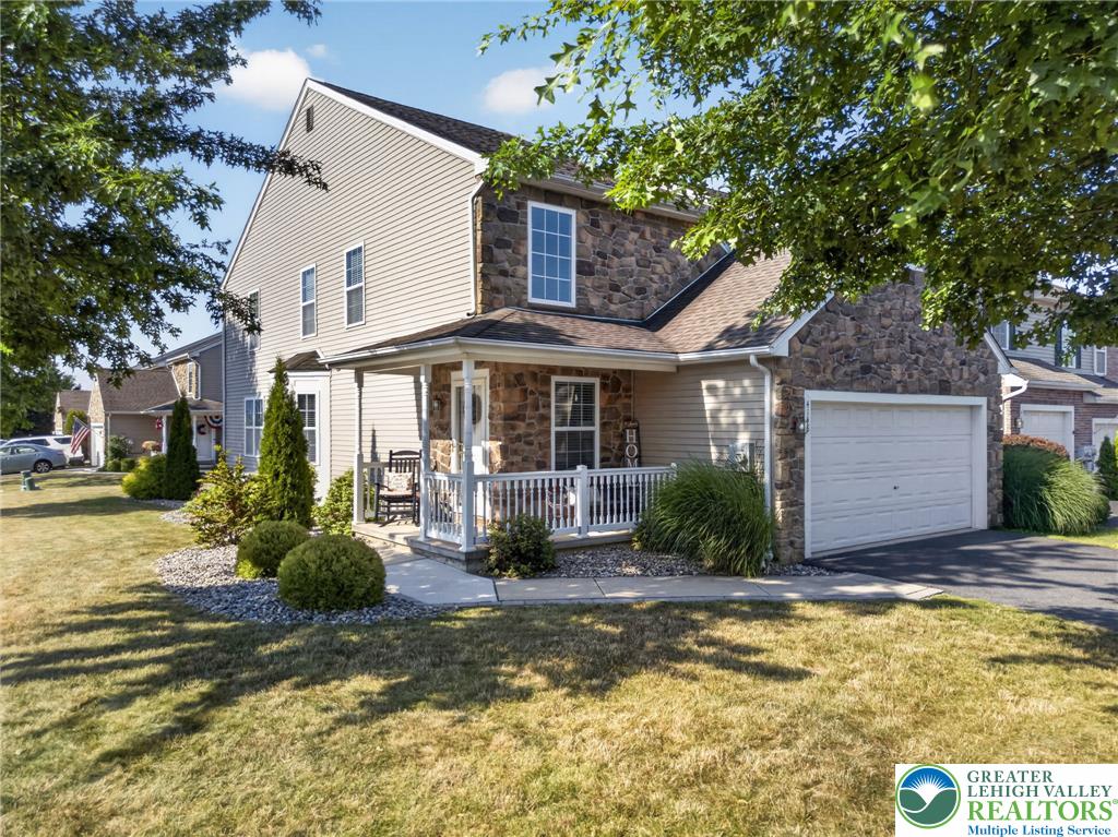 4148 Ross Road Bethlehem, PA 18020 - Photo 2 of 67 A charming facade combines stone accents and a welcoming porch for appealing curb appeal.