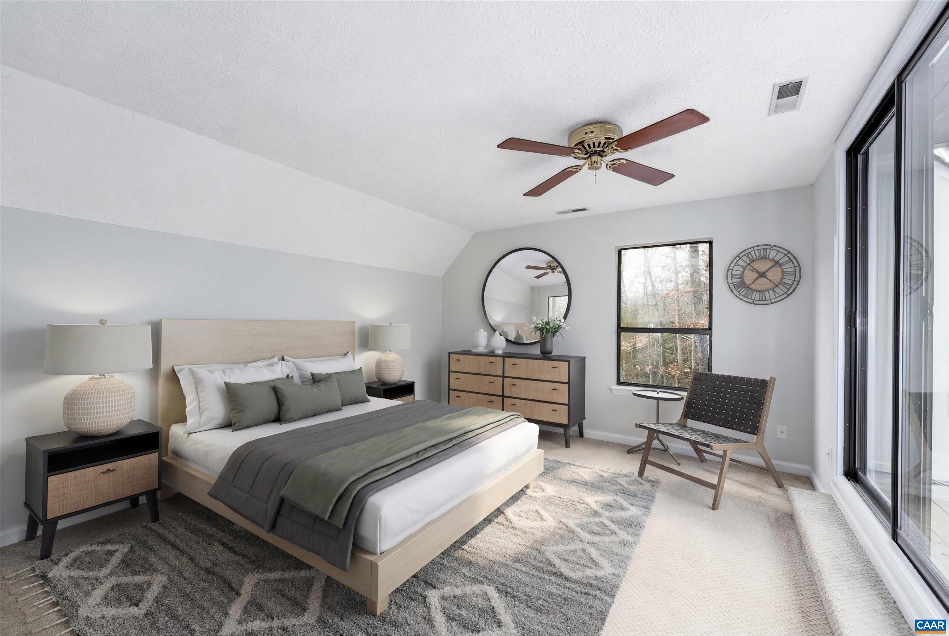 23 Stonewall Road Palmyra, VA 22963 - Photo 33 of 50 a bedroom with a bed a chandelier and chair
