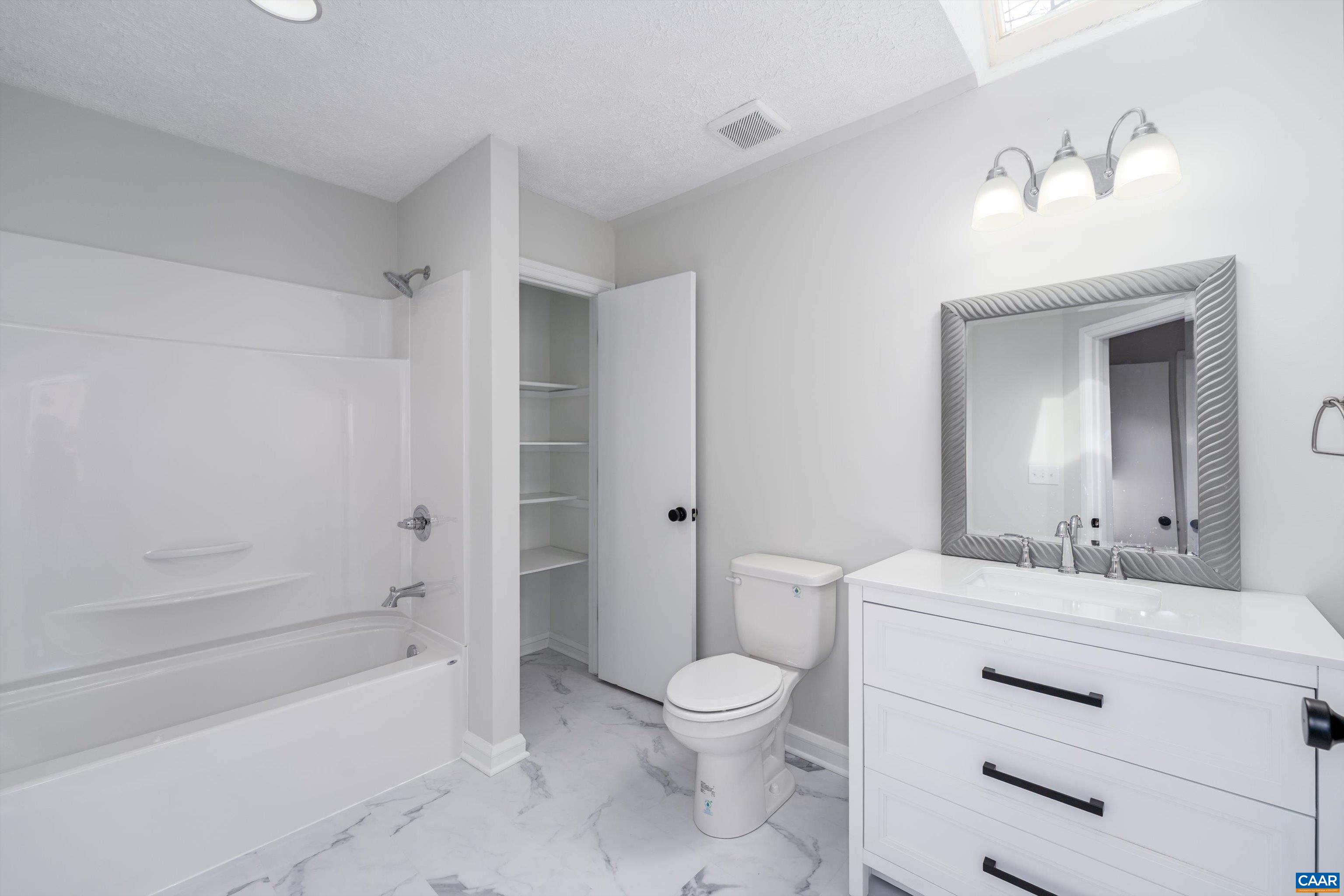 23 Stonewall Road Palmyra, VA 22963 - Photo 36 of 50 a bathroom with a sink a toilet and shower