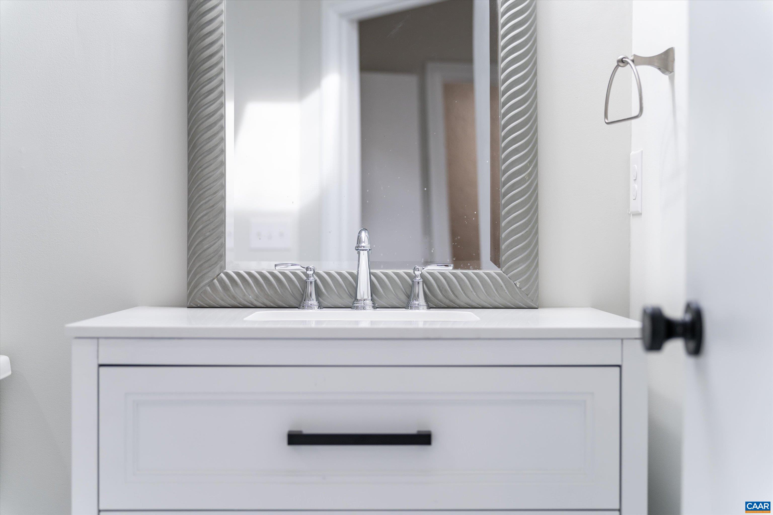 23 Stonewall Road Palmyra, VA 22963 - Photo 39 of 50 a bathroom with a sink and a mirror