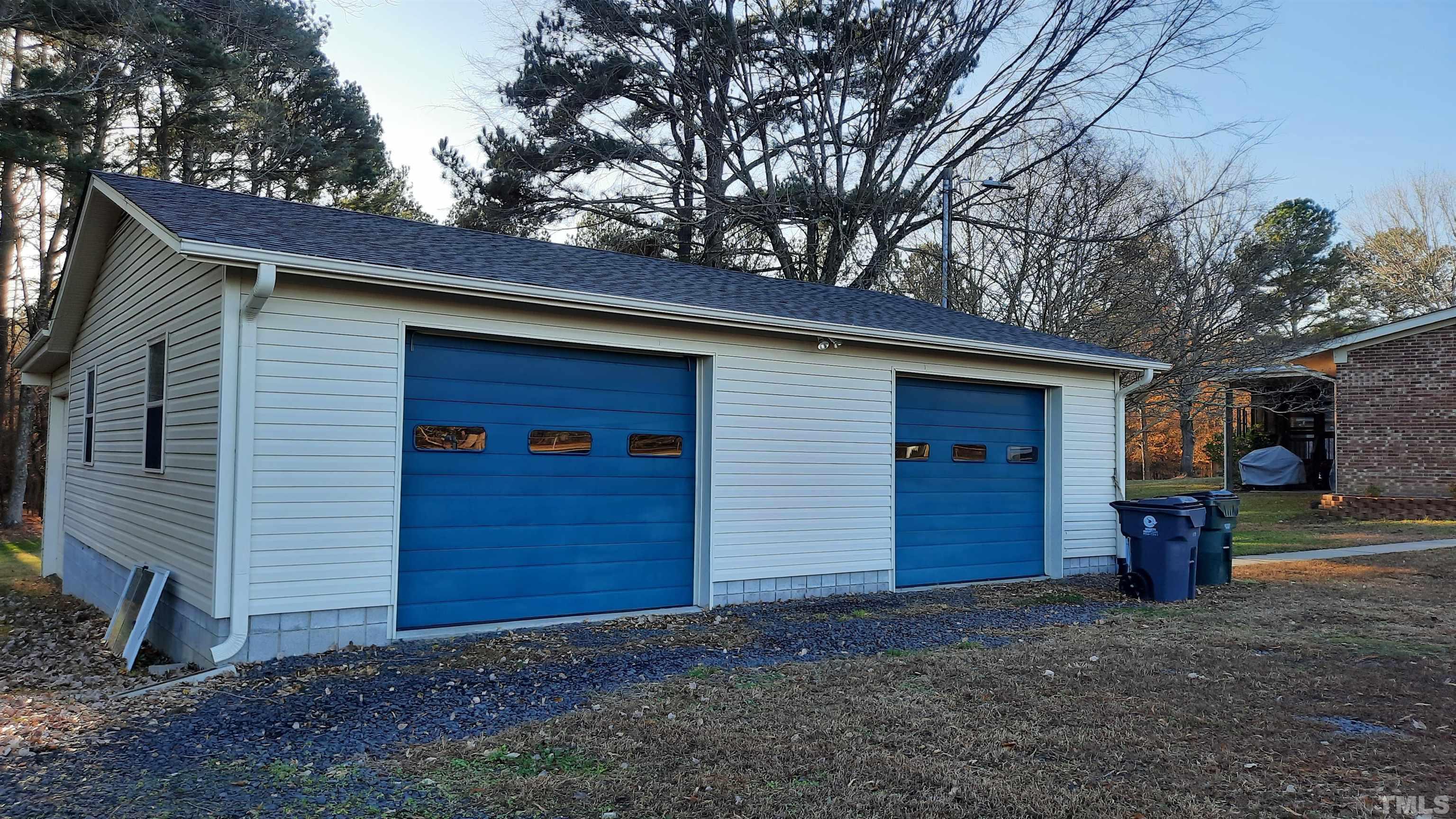 2117 Shaw Road Durham, NC 27704 - Photo 5 of 17 a view of a house with a yard and garage