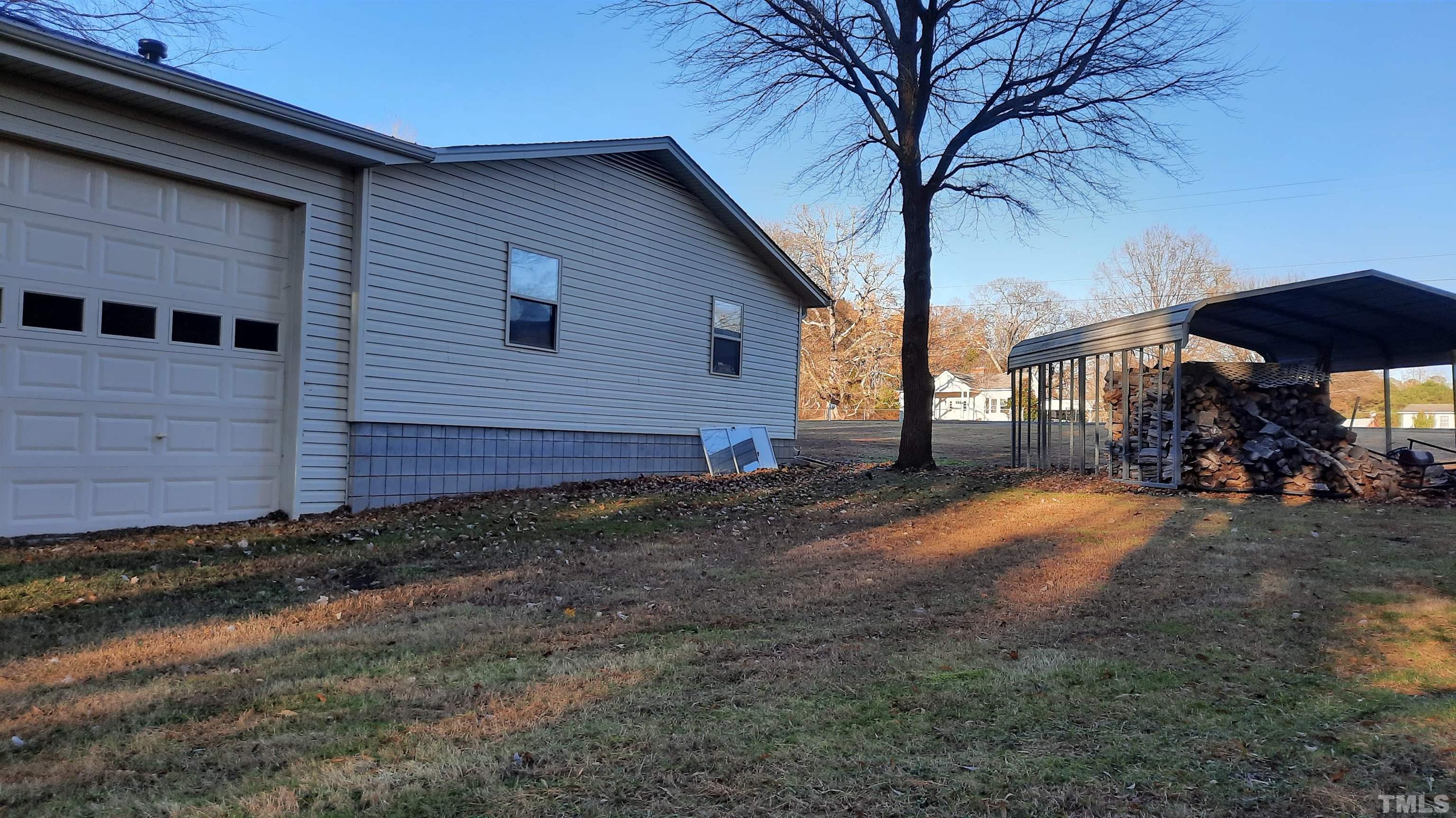2117 Shaw Road Durham, NC 27704 - Photo 6 of 17 a view of a house with a yard