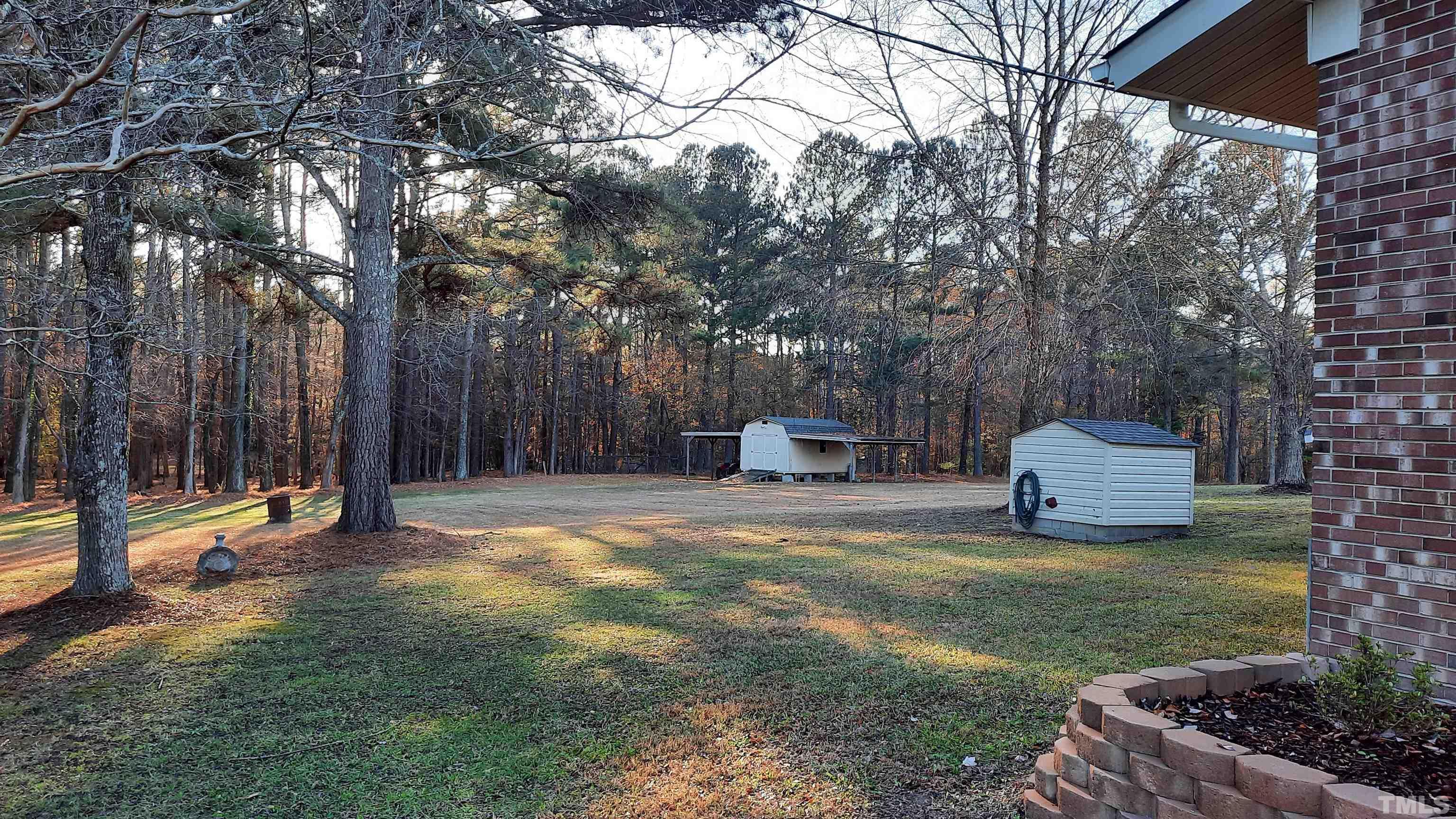 2117 Shaw Road Durham, NC 27704 - Photo 7 of 17 a house view with a backyard space