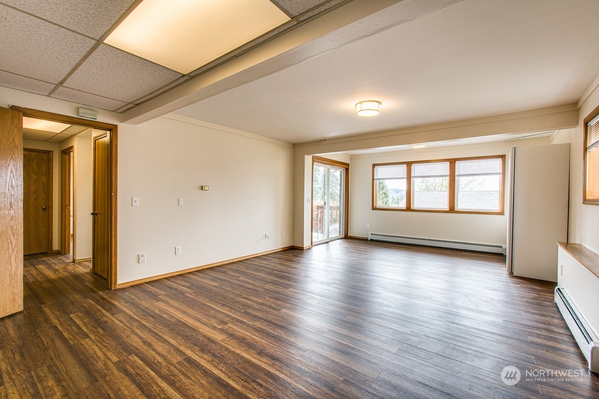 1818 35th Street Bellingham, WA 98229 - Photo 11 of 39 a view of empty room with wooden floor and fan