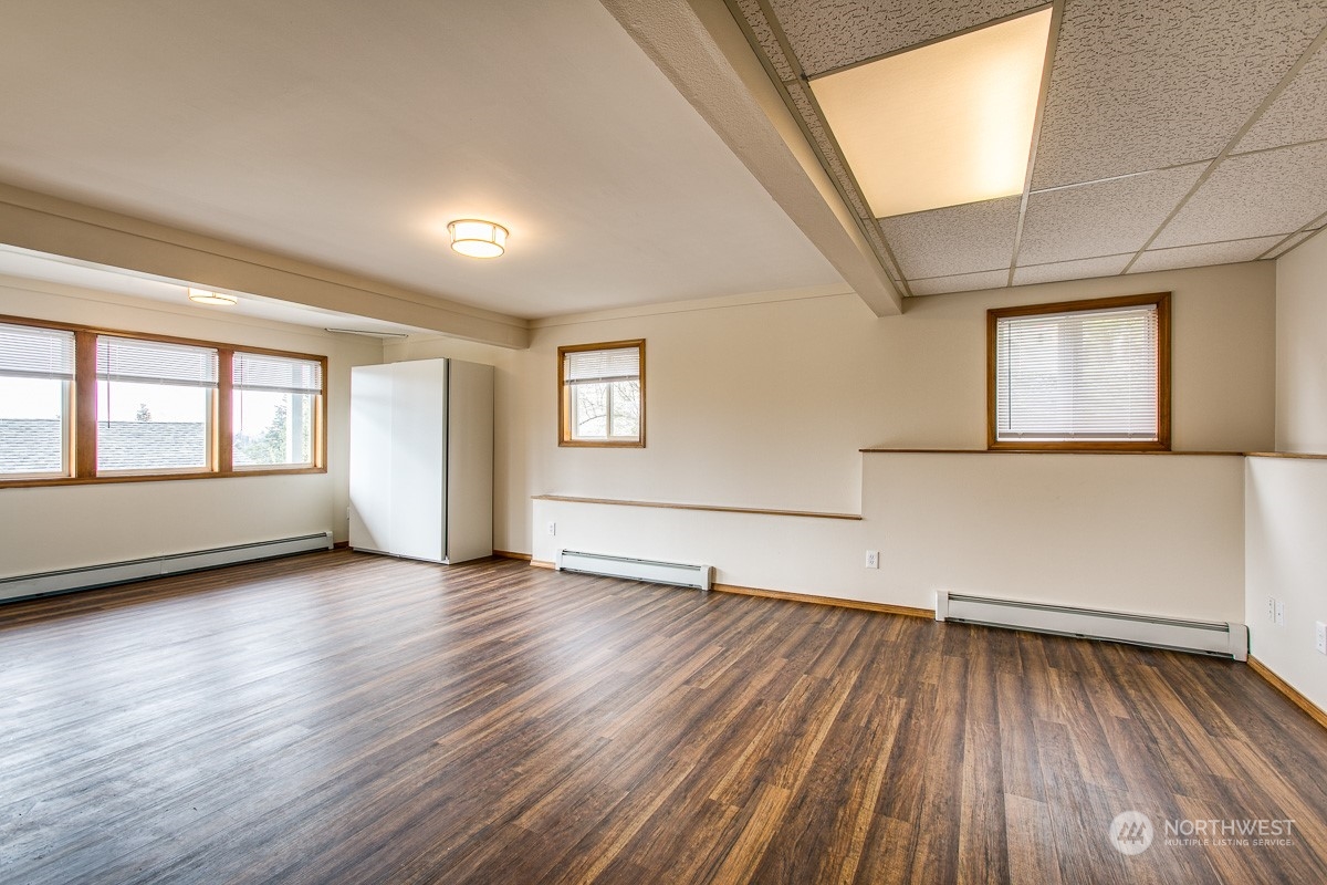 1818 35th Street Bellingham, WA 98229 - Photo 12 of 39 an empty room with wooden floor and windows
