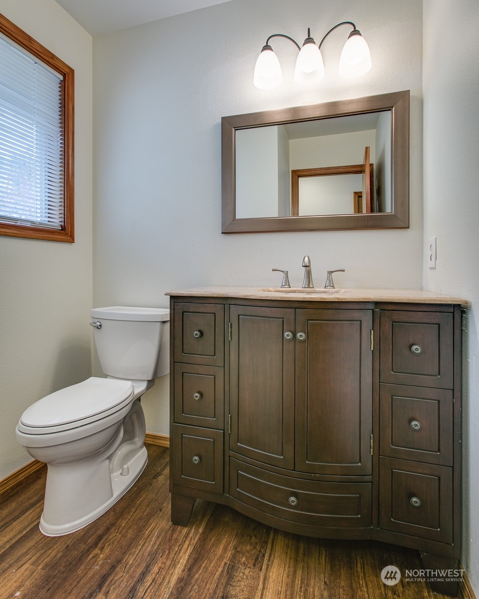 1818 35th Street Bellingham, WA 98229 - Photo 13 of 39 a bathroom with a toilet sink and mirror