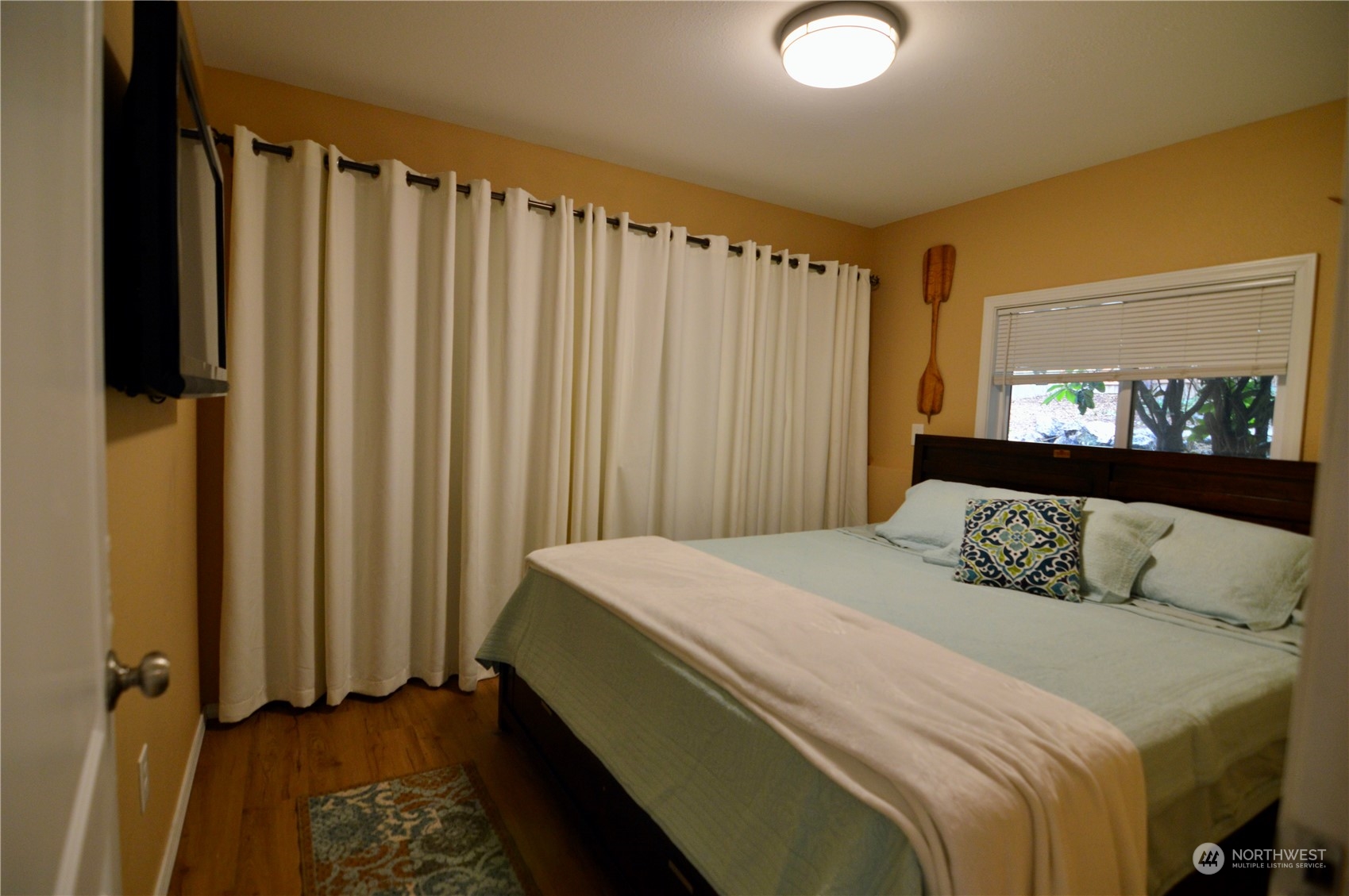 1818 35th Street Bellingham, WA 98229 - Photo 20 of 39 a bedroom with a bed and a mirror