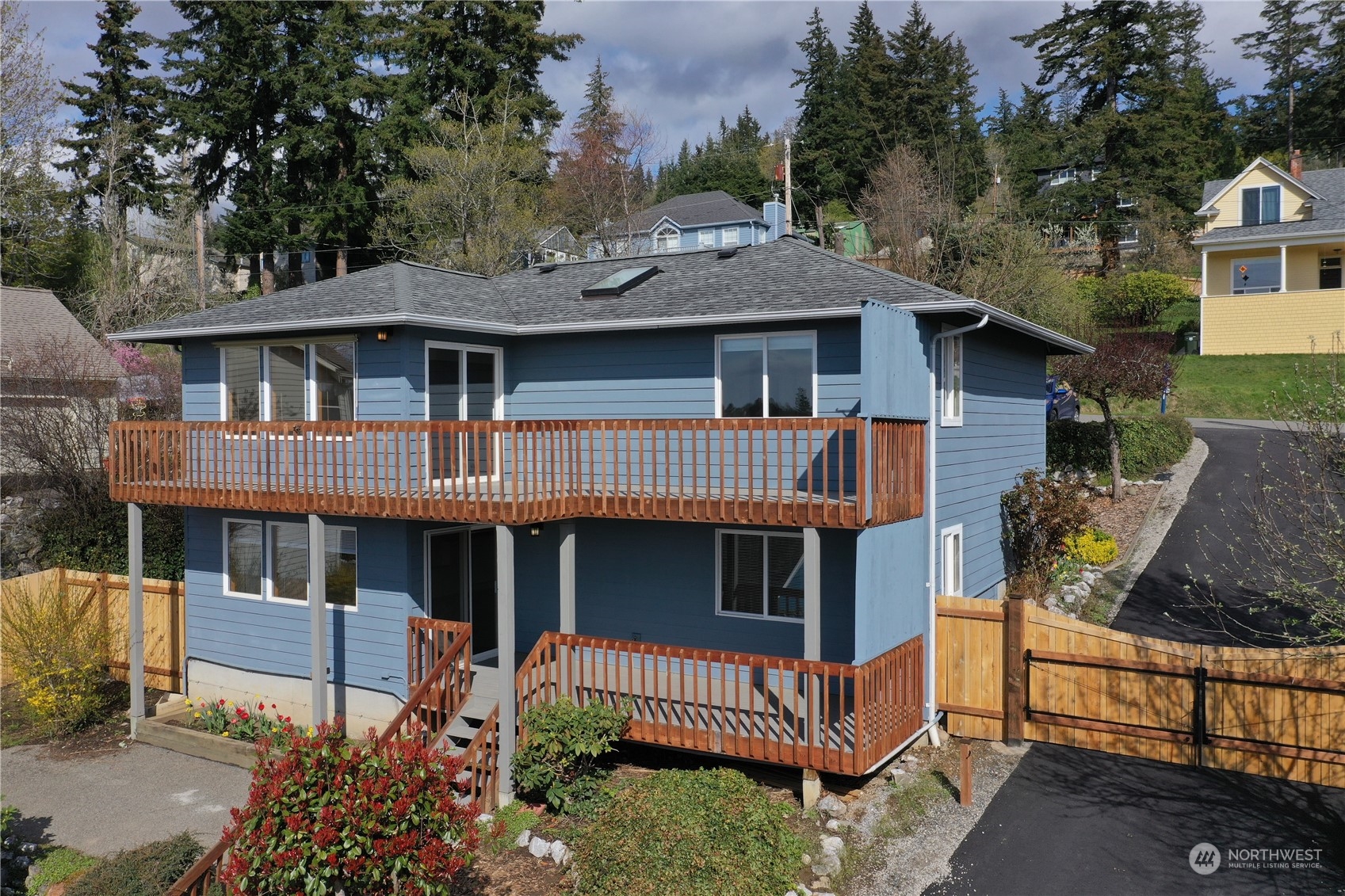 1818 35th Street Bellingham, WA 98229 - Photo 2 of 39 a view of a house with a yard and wooden fence