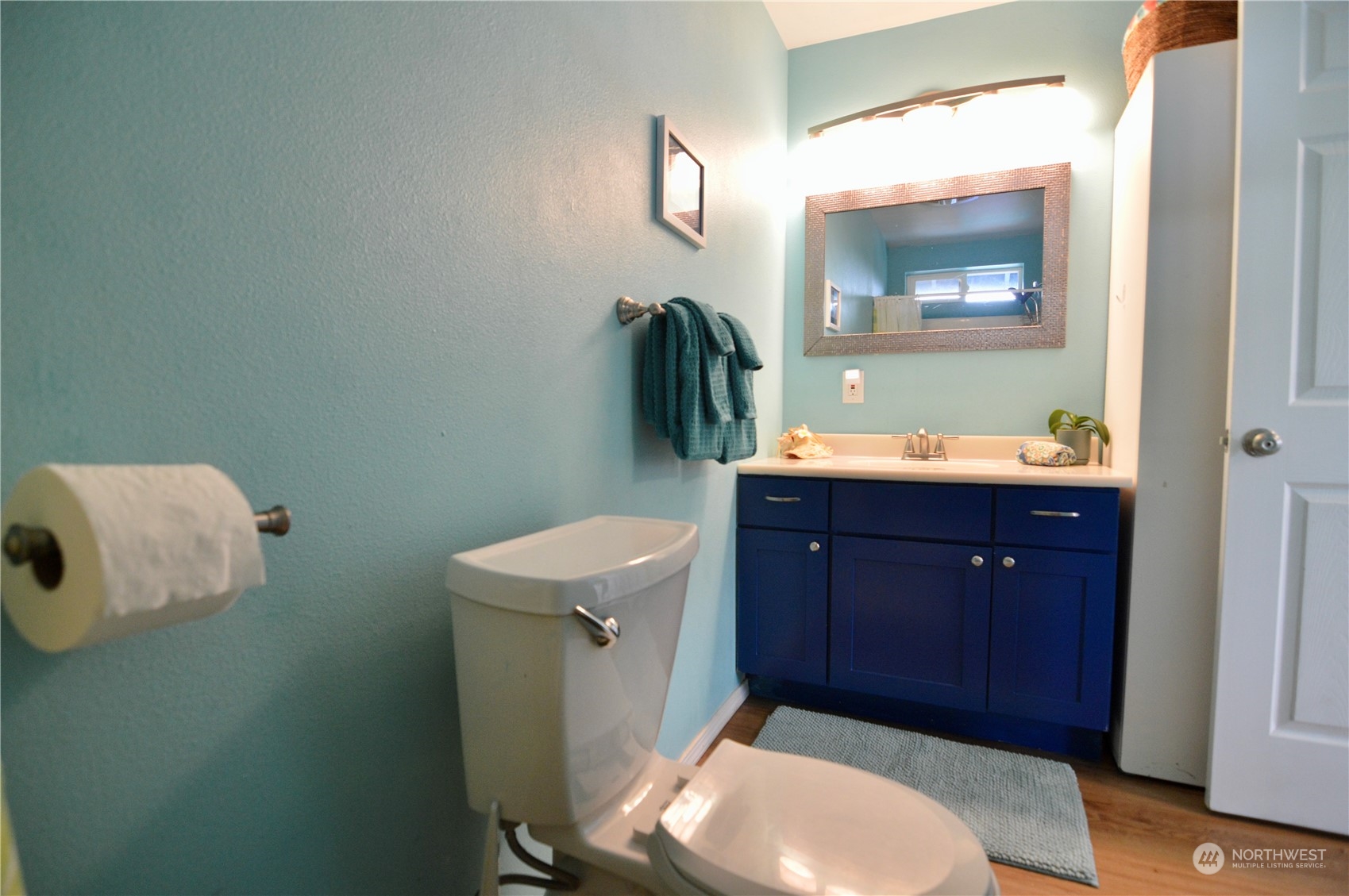 1818 35th Street Bellingham, WA 98229 - Photo 24 of 39 a bathroom with a toilet a sink and mirror