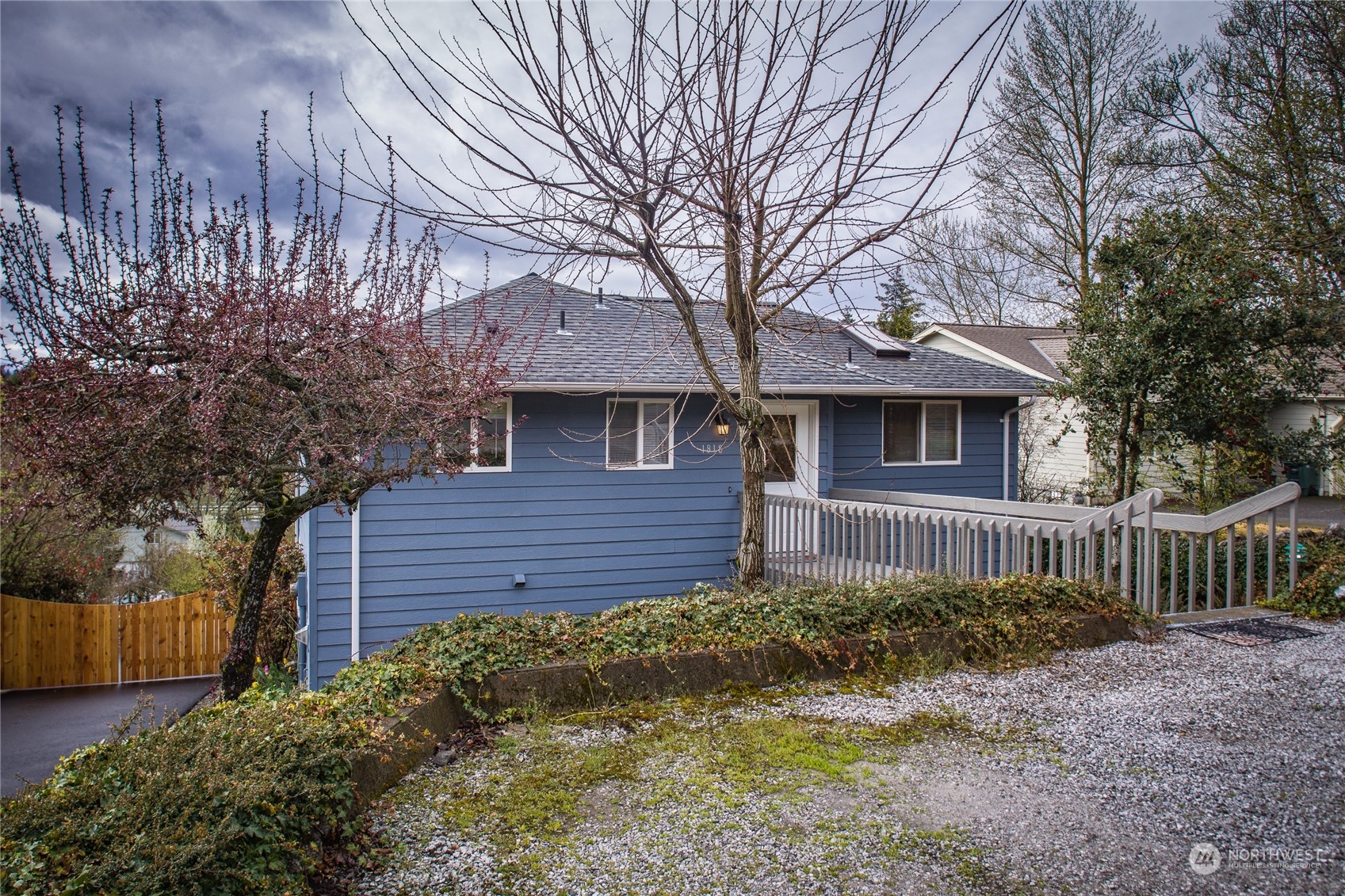 1818 35th Street Bellingham, WA 98229 - Photo 4 of 39 a front view of a house with a garden