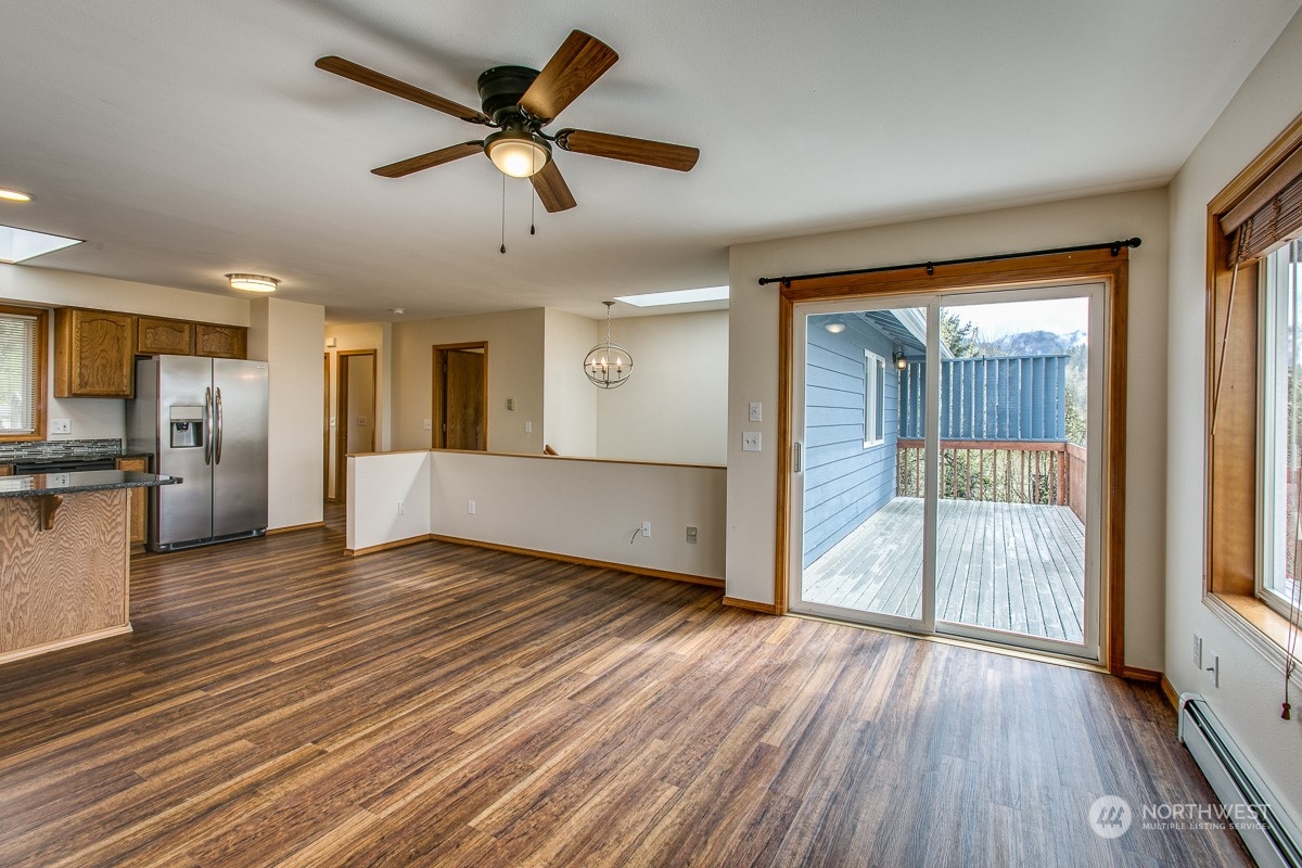 1818 35th Street Bellingham, WA 98229 - Photo 7 of 39 a view of empty room with wooden floor and fan