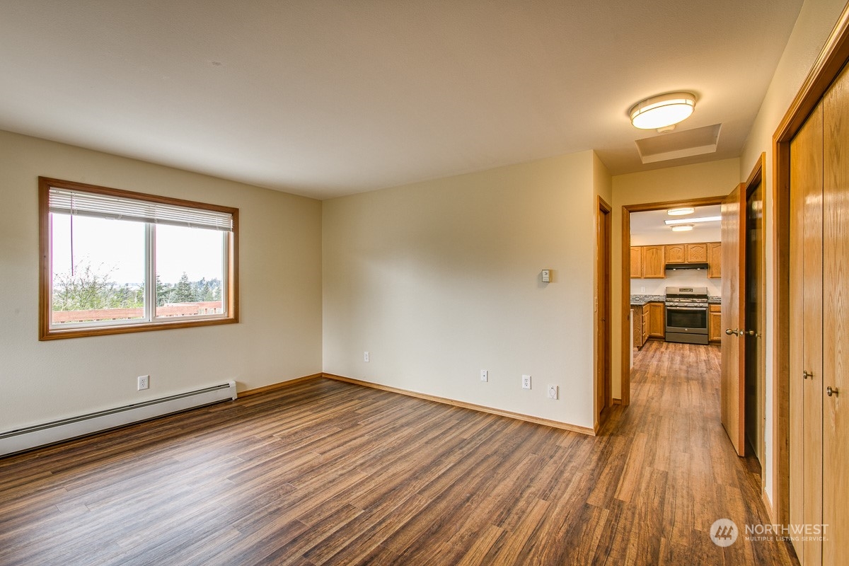 1818 35th Street Bellingham, WA 98229 - Photo 9 of 39 wooden floor in an empty room with a window
