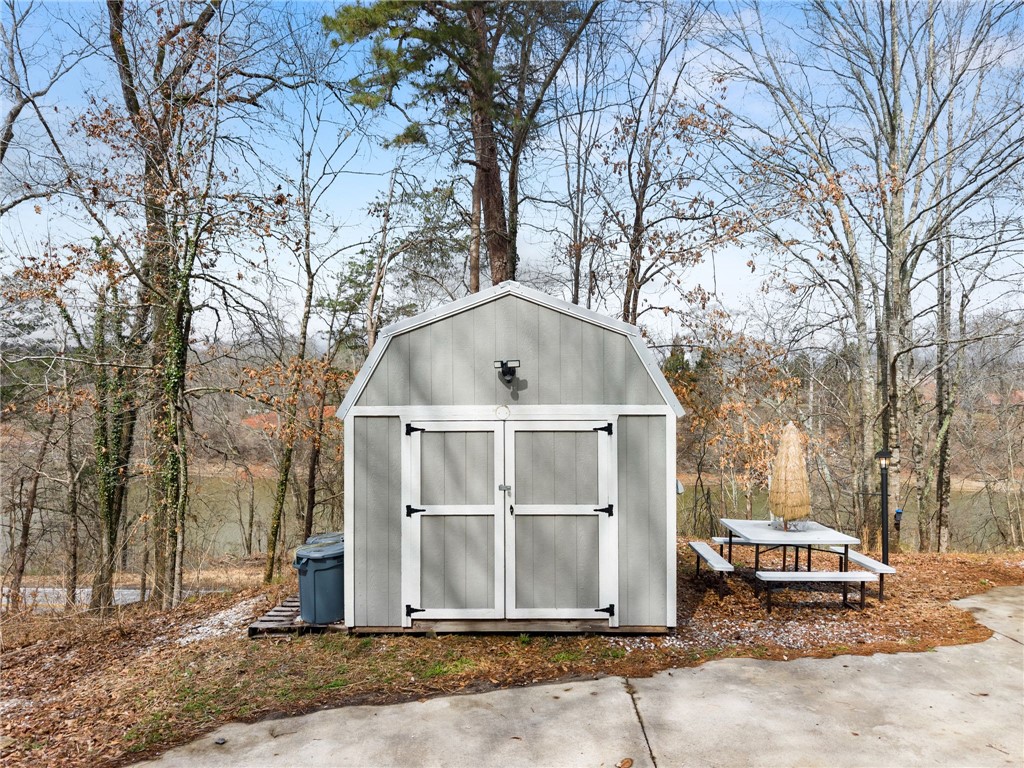 97 Cherokee Road Toccoa, GA 30577 - Photo 2 of 30 This charming storage shed offers practical outdoor utility with a view.