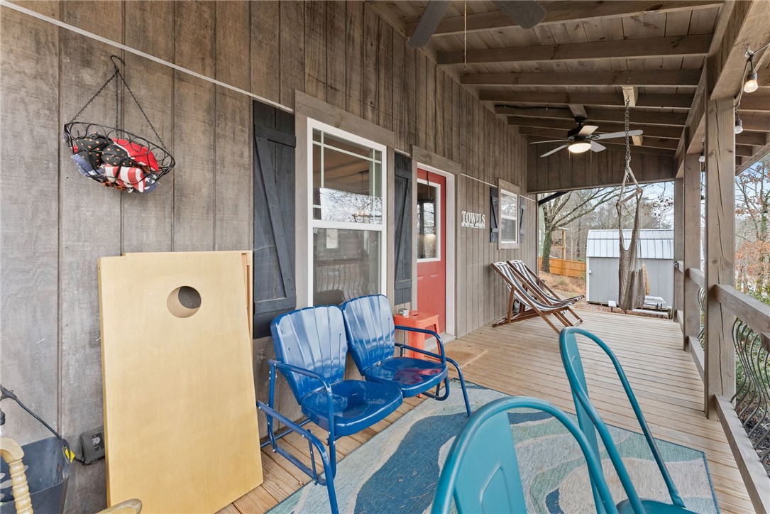 97 Cherokee Road Toccoa, GA 30577 - Photo 25 of 30 This inviting porch offers comfortable seating and ample space for relaxation.