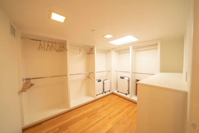 a bathroom with a tub sink and shower