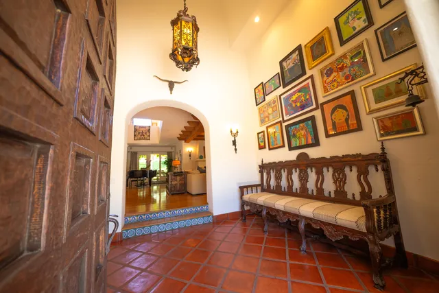 a view of a brick building with a bench in front of building