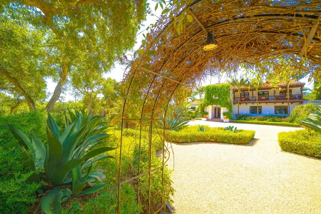 a view of yard with swimming pool and green space