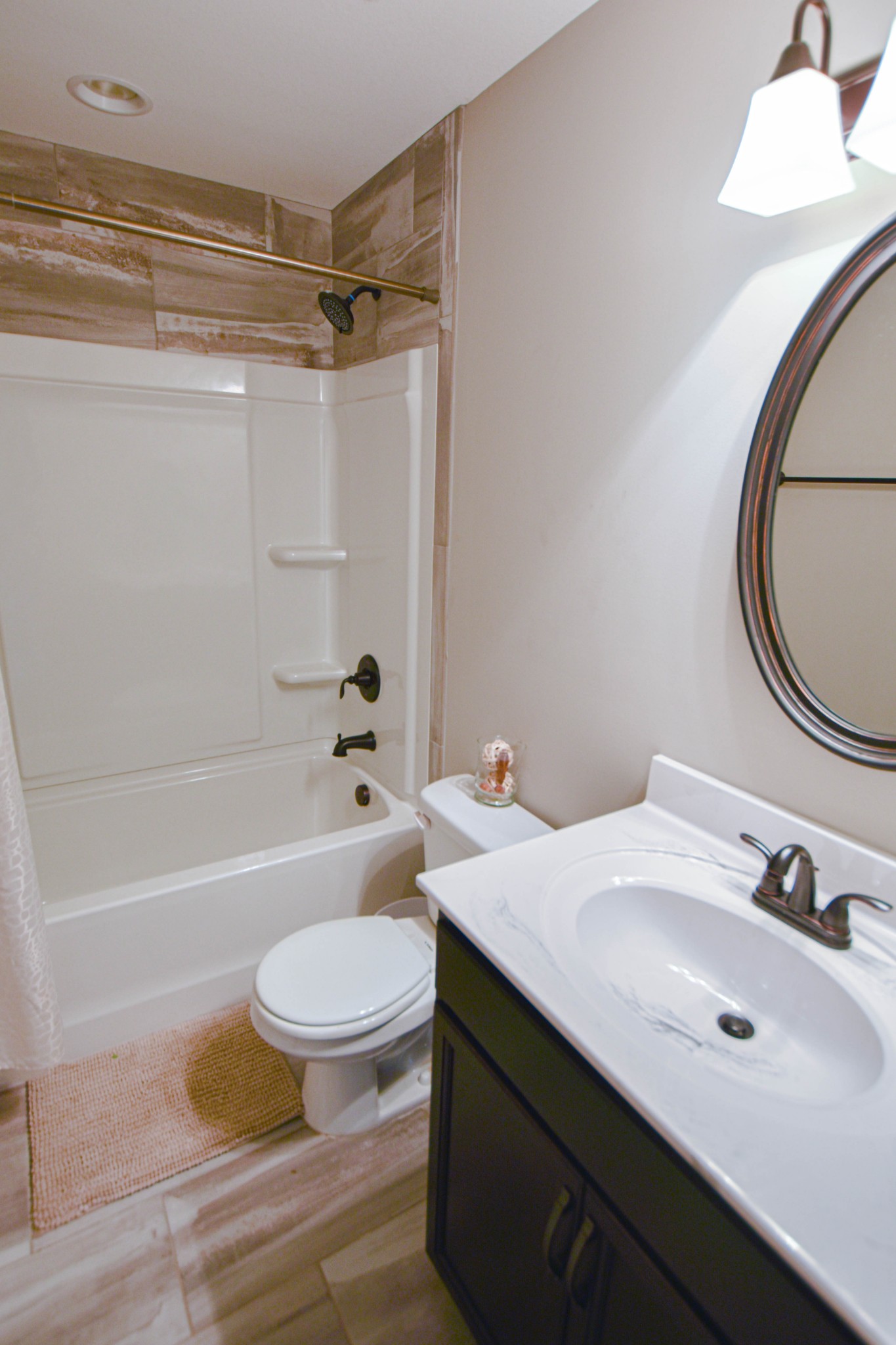 1880 Rains Road Clarksville, TN 37042 - Photo 14 of 20 a bathroom with a sink a toilet and a mirror