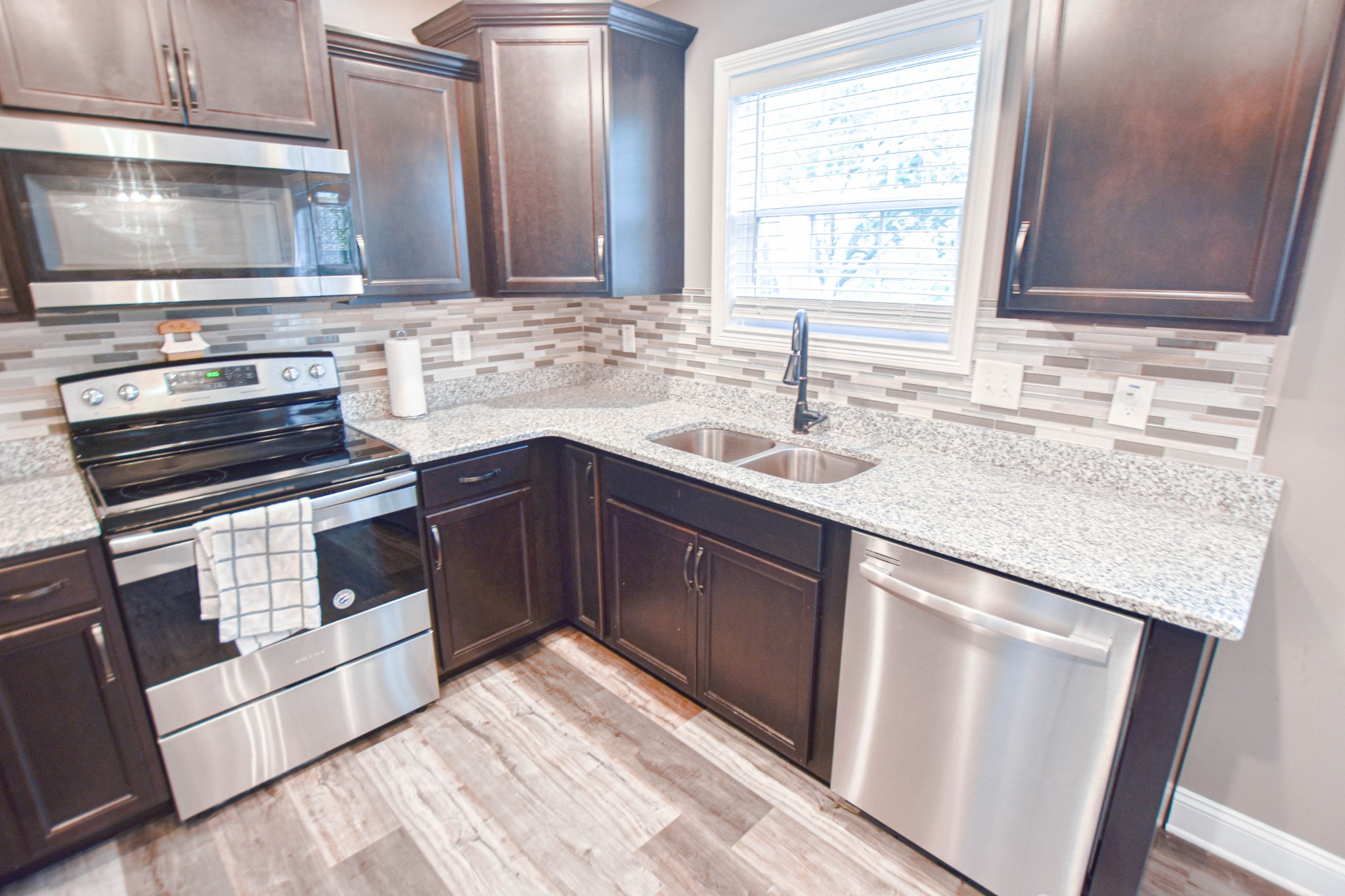1880 Rains Road Clarksville, TN 37042 - Photo 8 of 20 a kitchen with a sink stove and cabinets