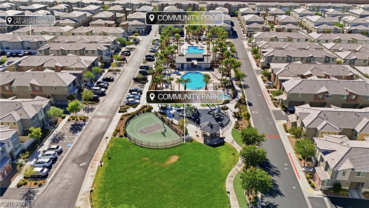 12240 Golden Wreath Road, Unit 2 Las Vegas, NV 89183 - Photo 25 of 29 An aerial perspective reveals extensive neighborhood recreation facilities nestled among residential streets.