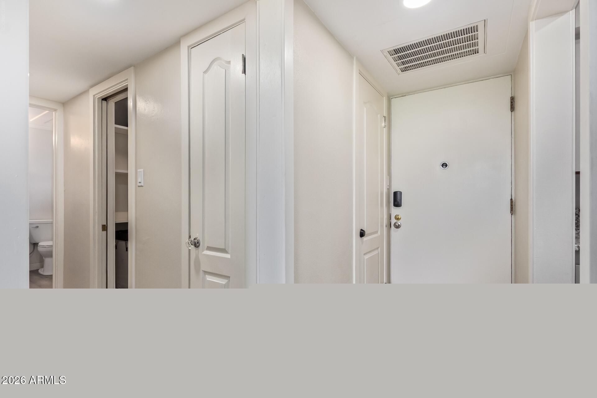 3242 East Camelback Road, Unit 106 Phoenix, AZ 85018 - Photo 14 of 17 Front door - hallway