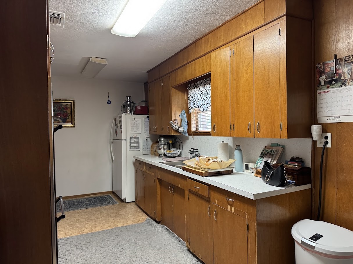 552 East Commerce Street Fairfield, TX 75840 - Photo 7 of 20 a kitchen with a sink stove and refrigerator