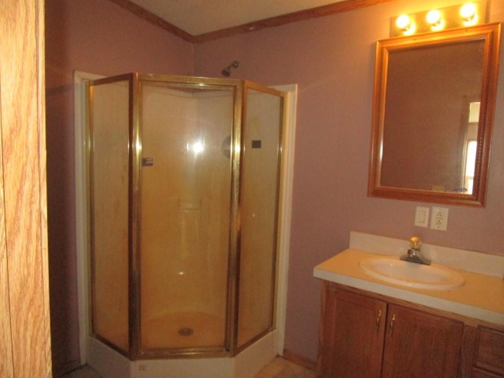 416 Plum Sock Road Prosperity, PA 15329 - Photo 18 of 22 a bathroom with a shower sink and mirror