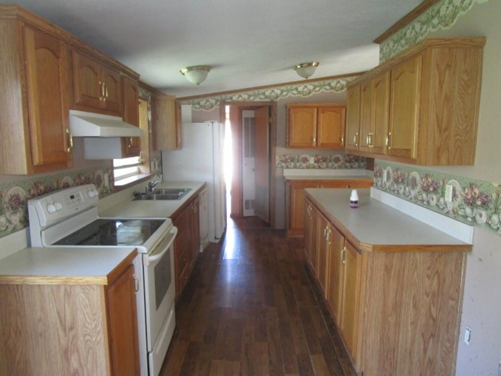 416 Plum Sock Road Prosperity, PA 15329 - Photo 7 of 22 a kitchen with stainless steel appliances granite countertop a sink stove and refrigerator