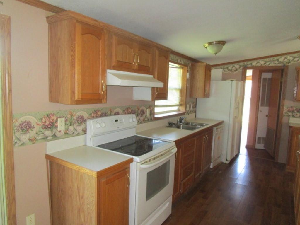 416 Plum Sock Road Prosperity, PA 15329 - Photo 8 of 22 a kitchen with a stove a sink and a refrigerator