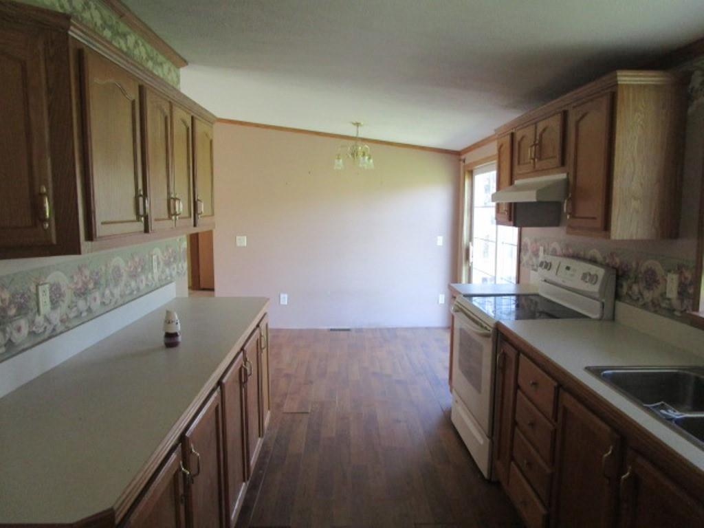 416 Plum Sock Road Prosperity, PA 15329 - Photo 10 of 22 a kitchen with stainless steel appliances granite countertop a sink a stove and a refrigerator
