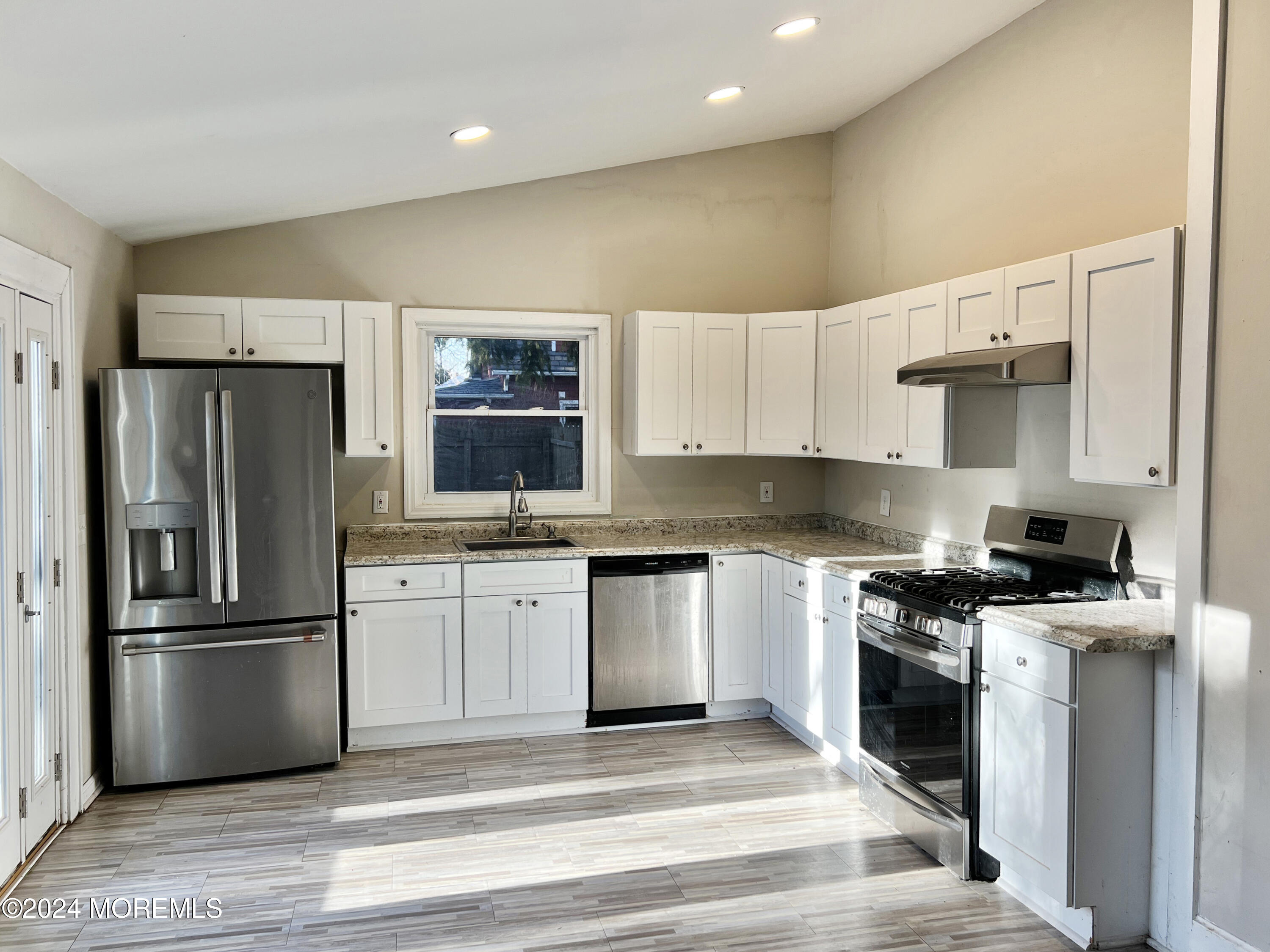 112 Pinehurst Road Brick, NJ 08723 - Photo 5 of 14 a kitchen with granite countertop a refrigerator stove top oven and sink