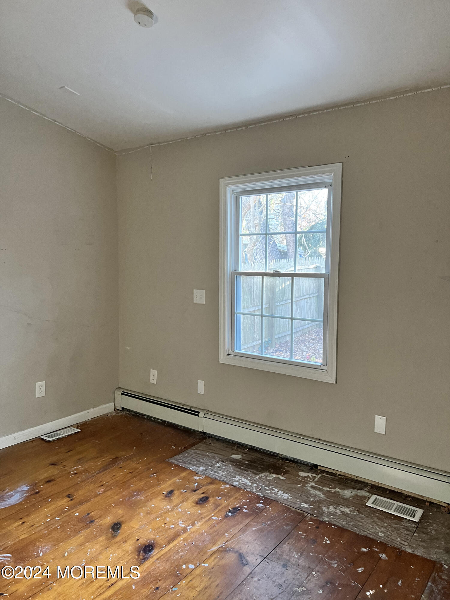112 Pinehurst Road Brick, NJ 08723 - Photo 8 of 14 an empty room with a window