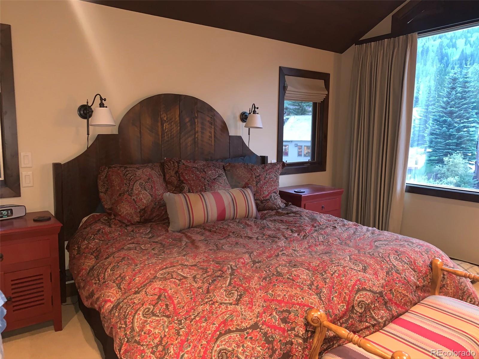 5148 Gore Circle Vail, CO 81657 - Photo 18 of 22 a bed sitting in a bedroom next to a window