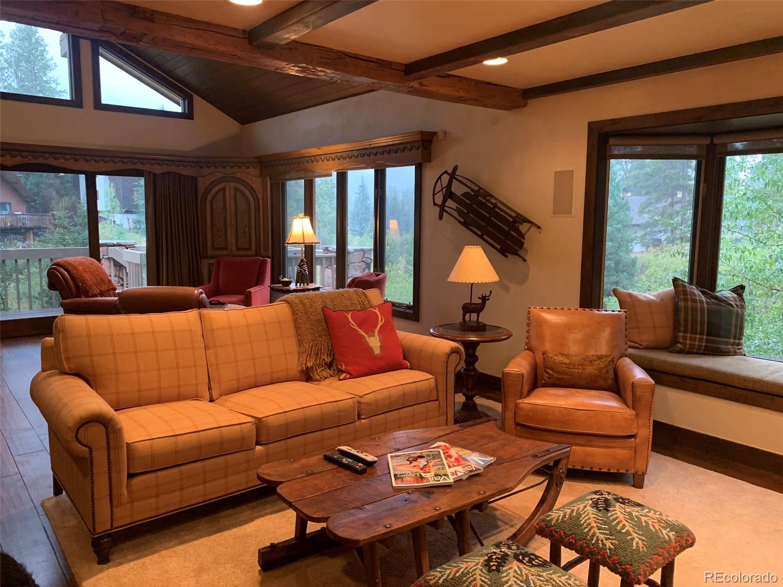 5148 Gore Circle Vail, CO 81657 - Photo 2 of 22 a living room with furniture a large window and a rug