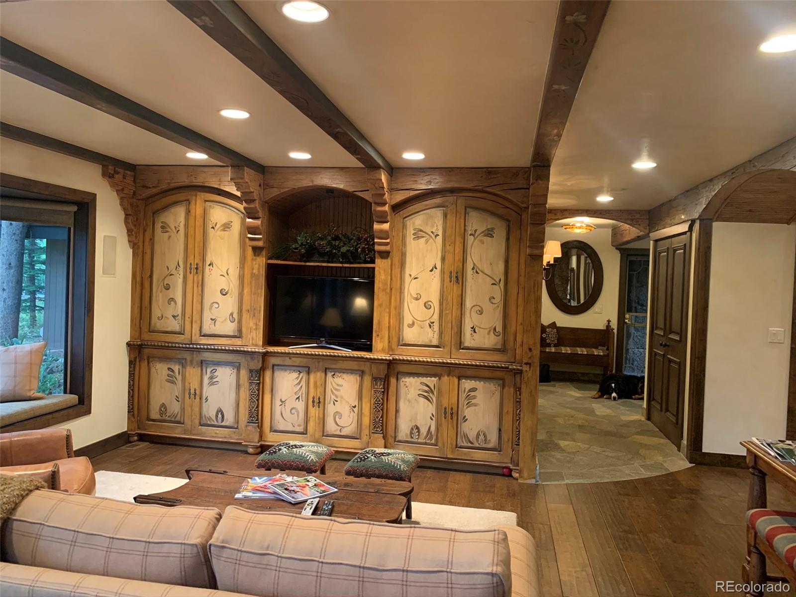 5148 Gore Circle Vail, CO 81657 - Photo 4 of 22 a living room with furniture a window and a clock