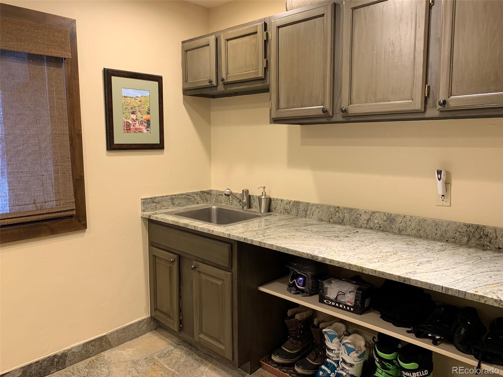 5148 Gore Circle Vail, CO 81657 - Photo 7 of 22 a kitchen with a sink and cabinets