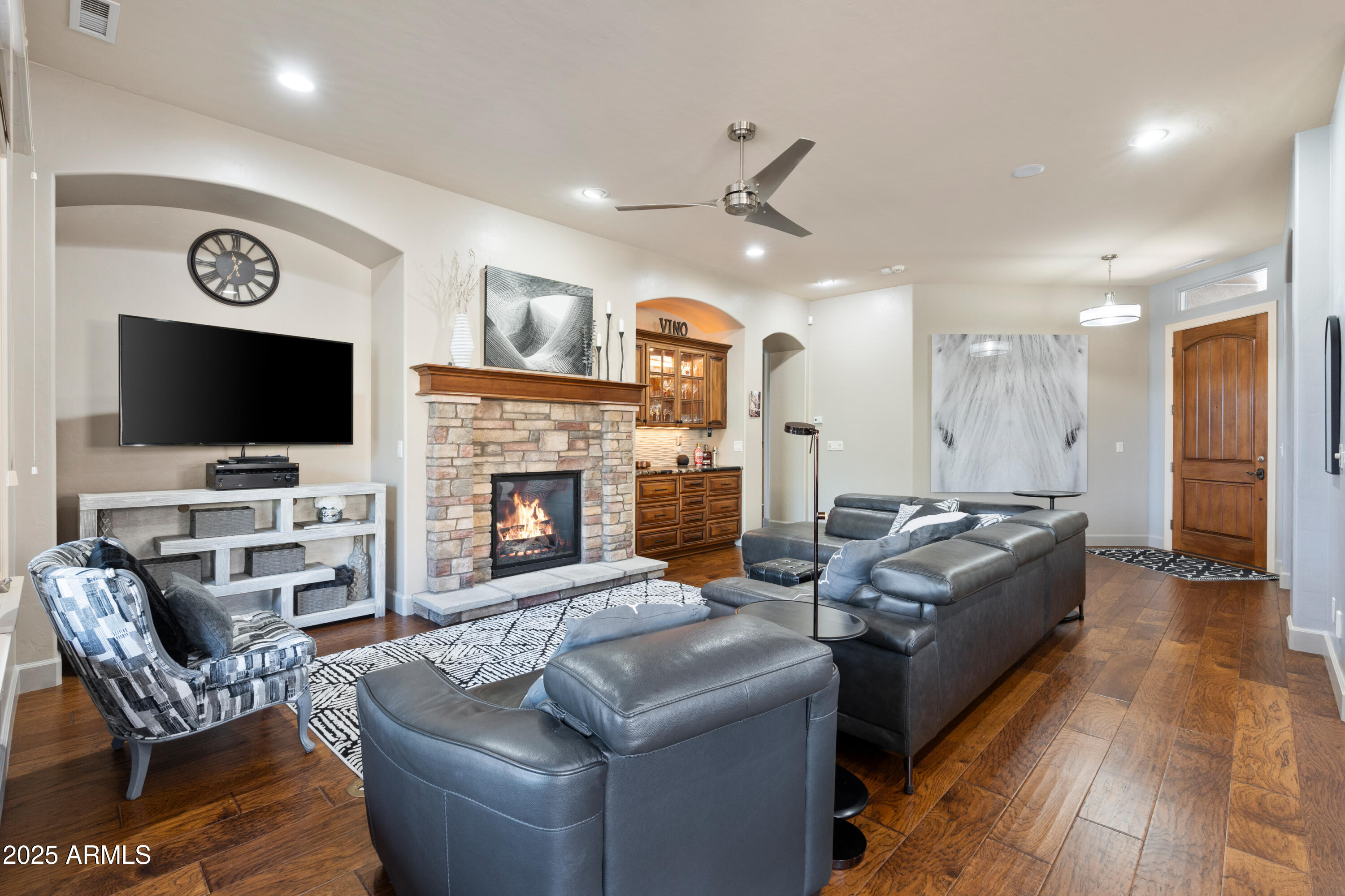 1672 Stable Rock Road Prescott, AZ 86303 - Photo 11 of 47 a living room with fireplace furniture and a flat screen tv
