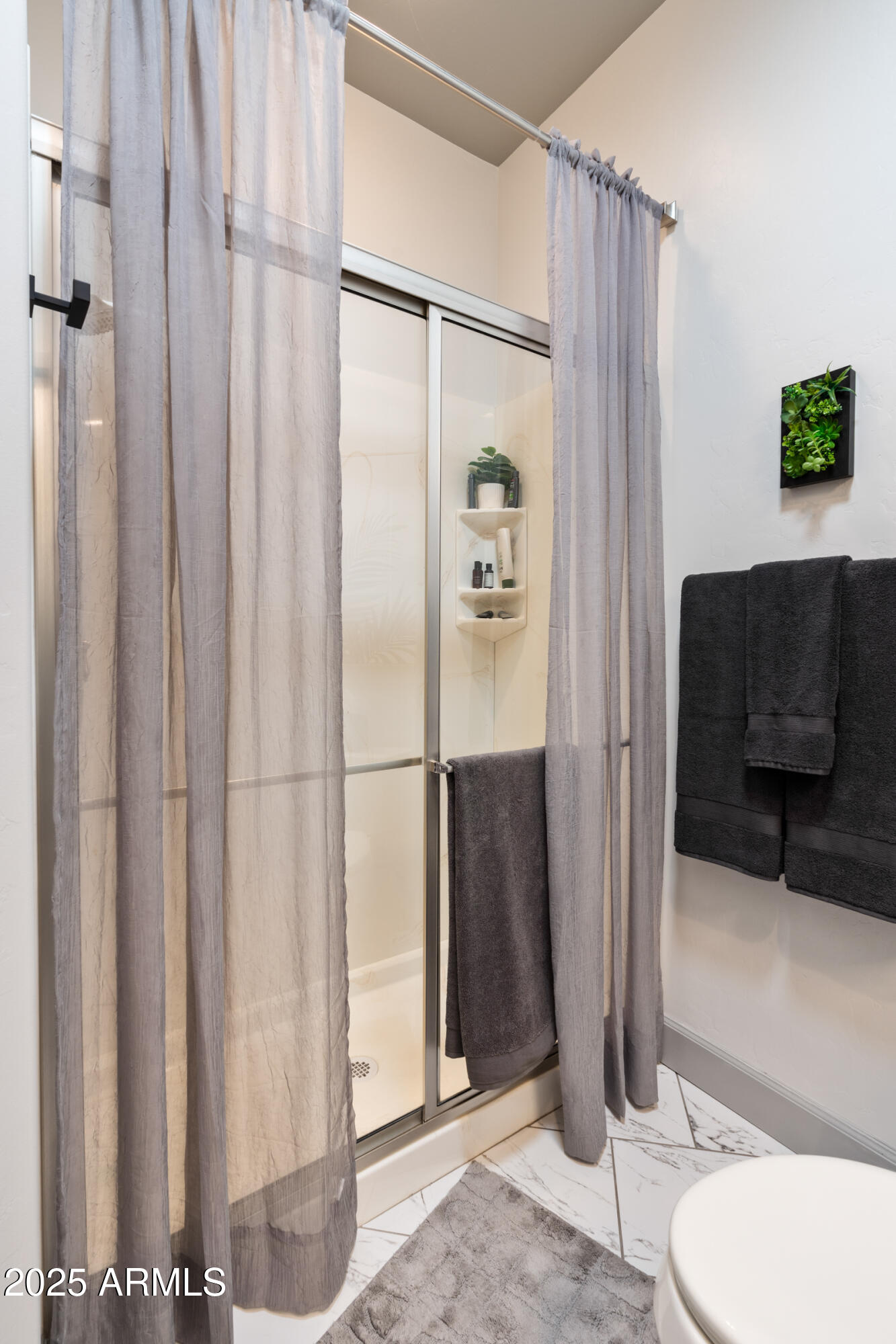 1672 Stable Rock Road Prescott, AZ 86303 - Photo 20 of 47 a bathroom with a toilet and a shower curtain