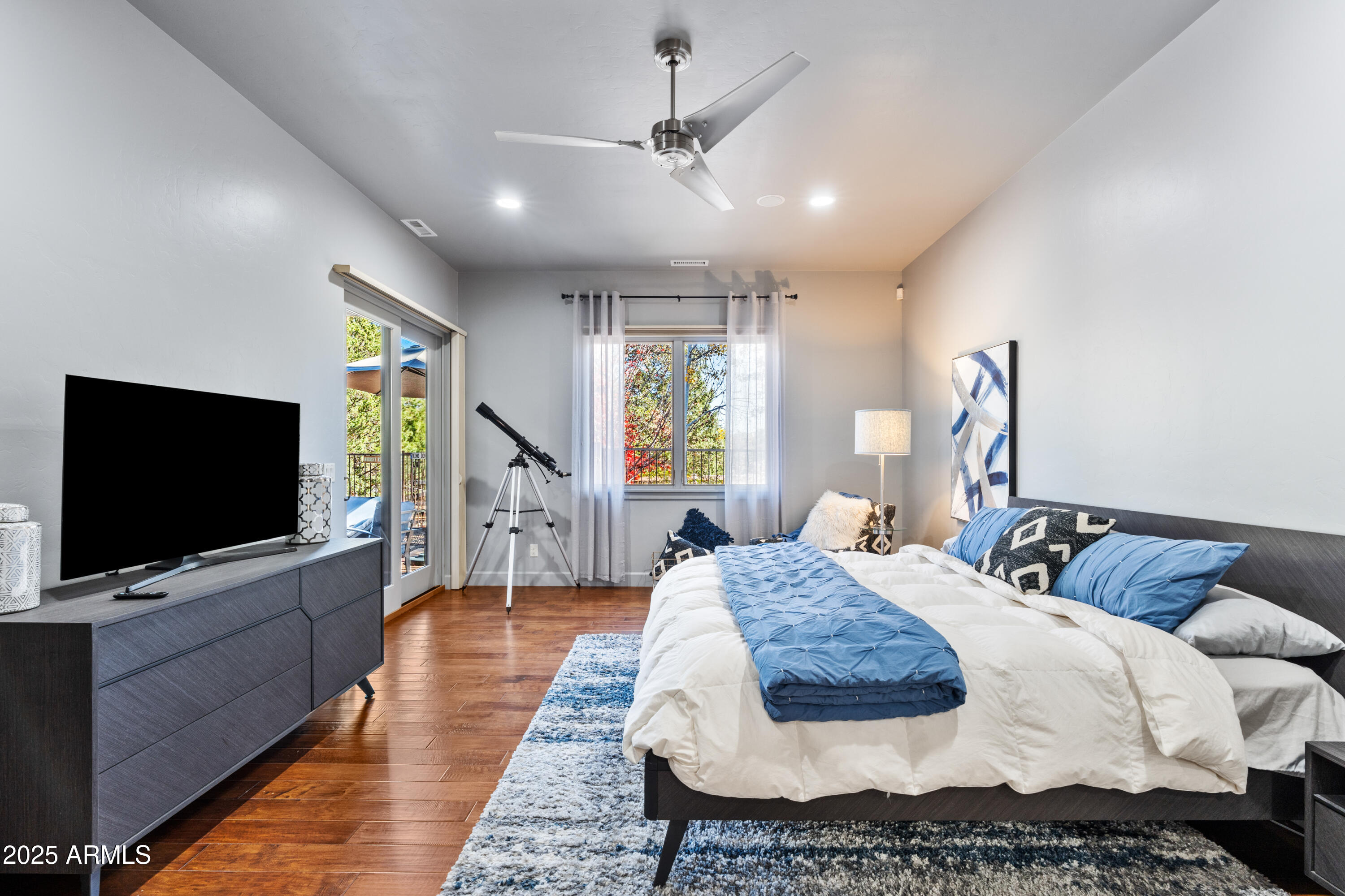 1672 Stable Rock Road Prescott, AZ 86303 - Photo 23 of 47 a bedroom with a bed and a flat screen tv