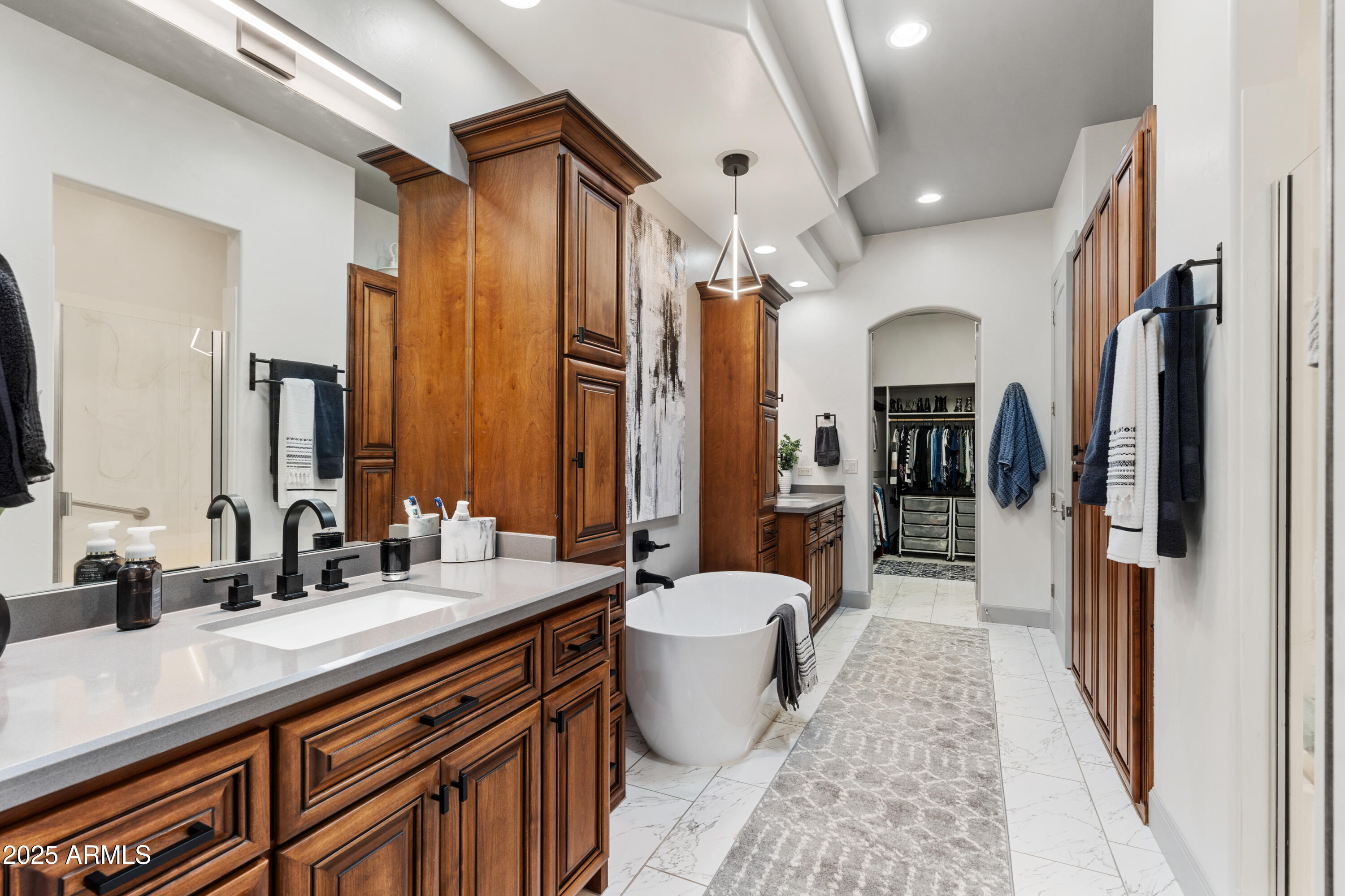1672 Stable Rock Road Prescott, AZ 86303 - Photo 25 of 47 a spacious bathroom with a double vanity sink a large mirror and shower