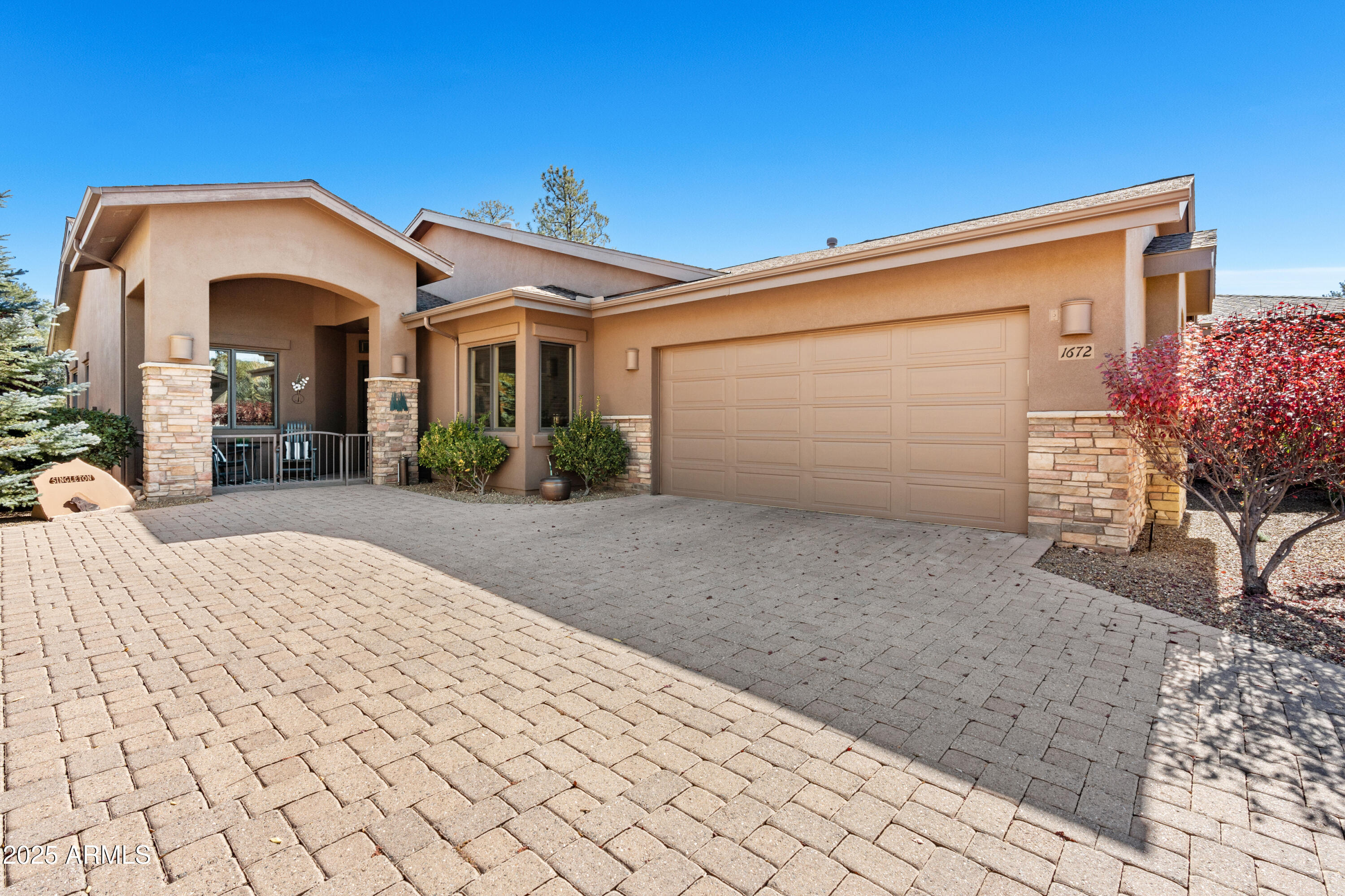 1672 Stable Rock Road Prescott, AZ 86303 - Photo 3 of 47 a front view of a house with a yard and garage