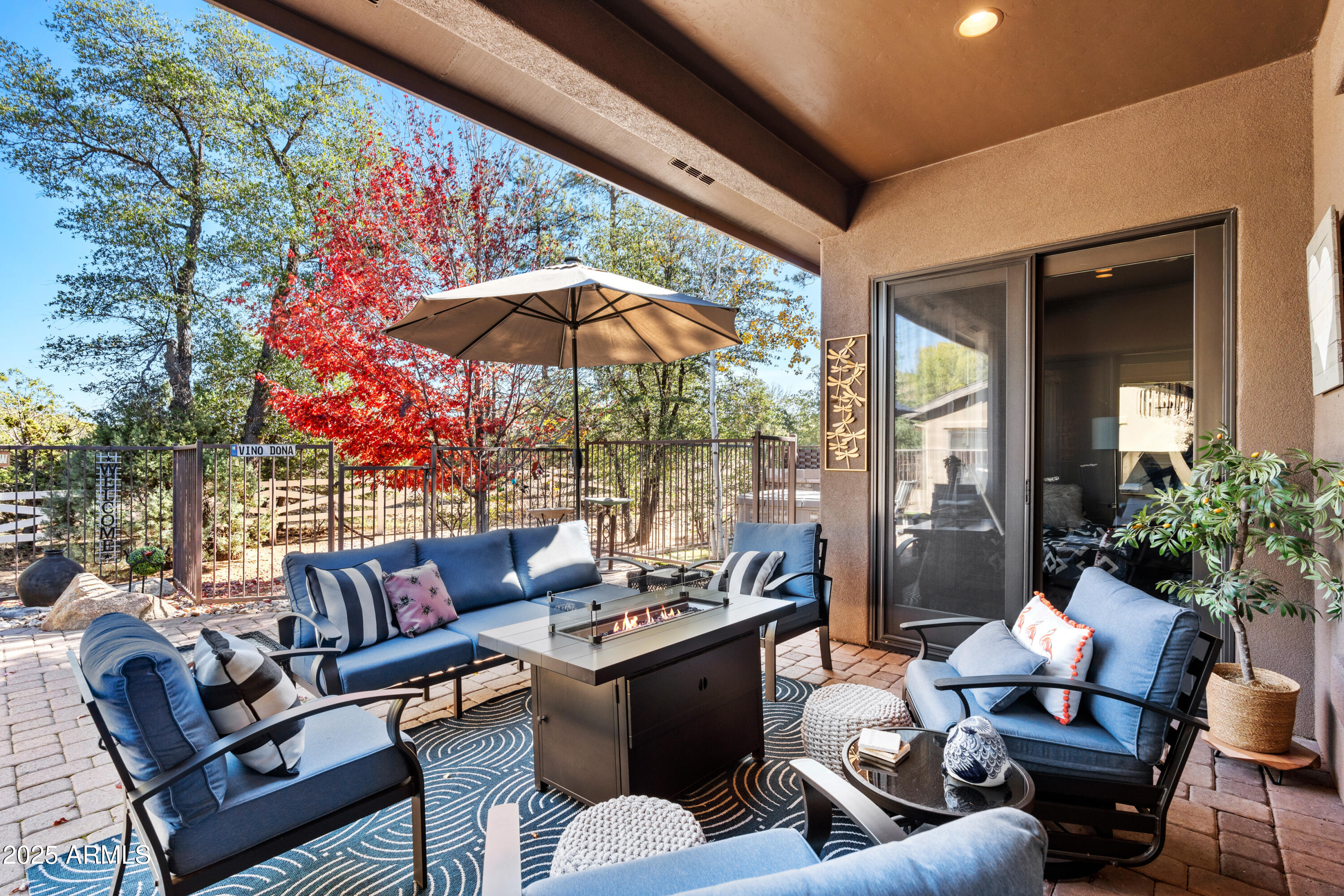 1672 Stable Rock Road Prescott, AZ 86303 - Photo 34 of 47 a outdoor living space with furniture and umbrella