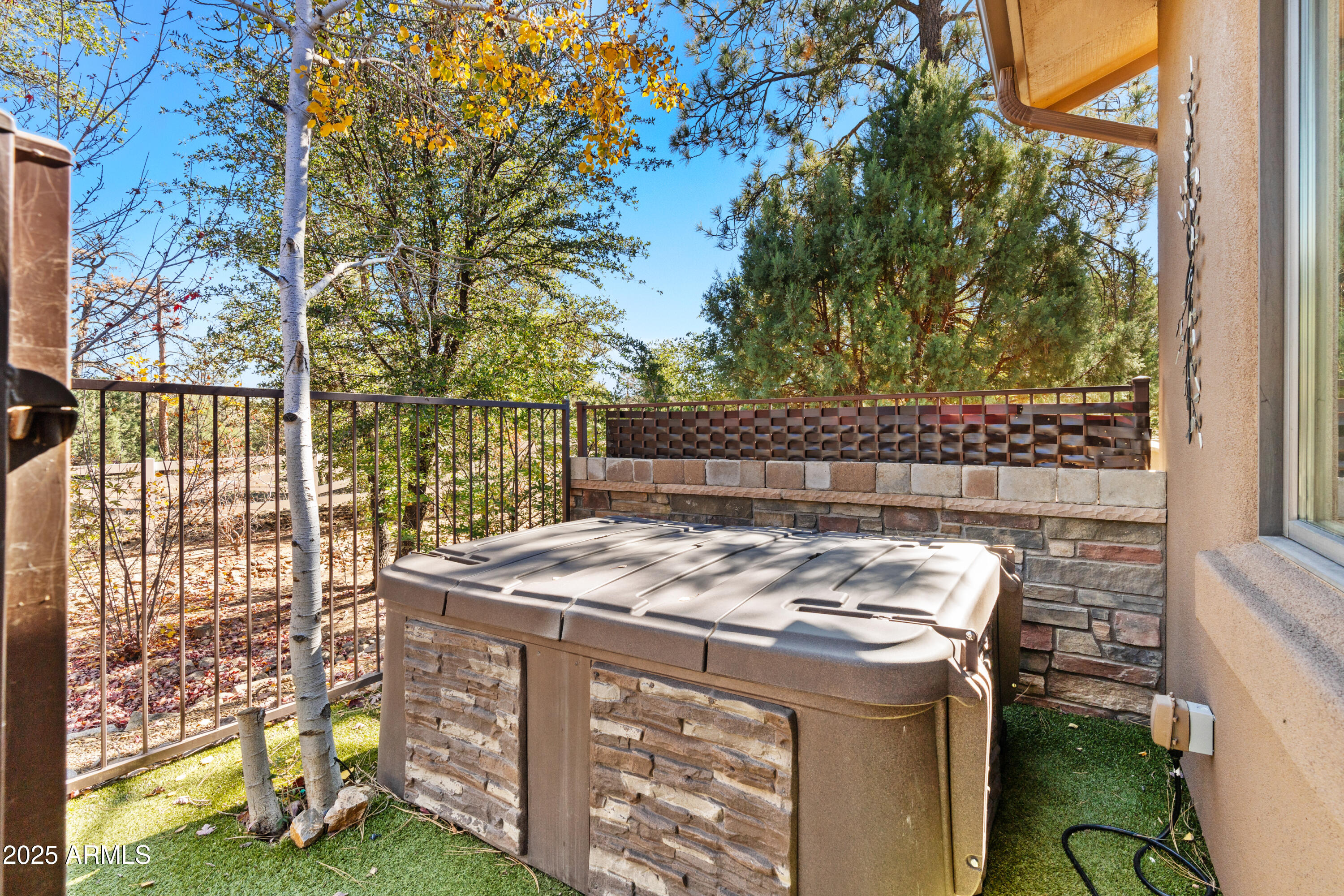 1672 Stable Rock Road Prescott, AZ 86303 - Photo 39 of 47 a view of a patio with table and chairs with wooden fence